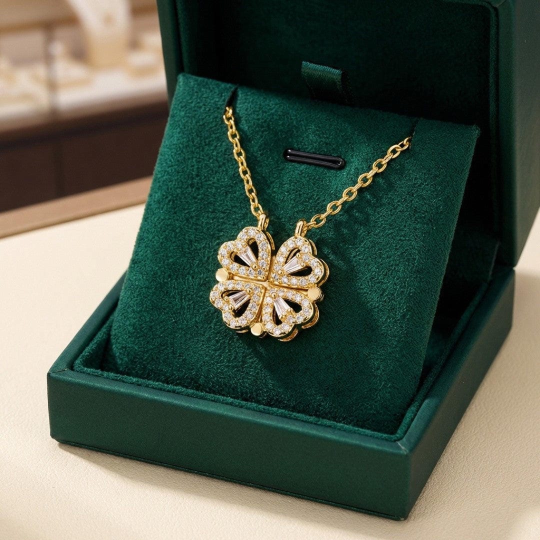 "Collana con Trifoglio Dorato e Pendente a Cuore in Zircone" could be rewritten as "Collana con Trifoglio Oro e Pendente a Cuore in Zircone".