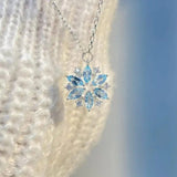 Collana a Fiore in Oro Bianco con Fiocco di Neve Blu