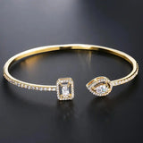 Bracciale Aperto in Oro con Doppia Gemma