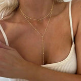 Collana lunga a doppio strato con perline dorate