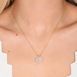 "Collana con Trifoglio Dorato e Pendente a Cuore in Zircone" could be rewritten as "Collana con Trifoglio Oro e Pendente a Cuore in Zircone".
