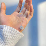 Collana a Fiore in Oro Bianco con Fiocco di Neve Blu