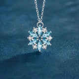 Collana a Fiore in Oro Bianco con Fiocco di Neve Blu